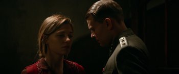 Movie still from “Overlord” (2018), directed by Julius Avery – A man and a woman standing next to each other; Close Up shot, Low angle