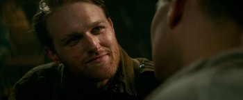 Movie still from “Overlord” (2018), directed by Julius Avery – A person looking at a mirror; Close Up shot, Over the shoulder angle