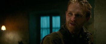 Movie still from “Overlord” (2018), directed by Julius Avery – A person wearing a jacket; Close Up shot, Over the shoulder angle