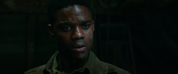 Movie still from “Overlord” (2018), directed by Julius Avery – A person wearing a jacket; Close Up shot, Low angle