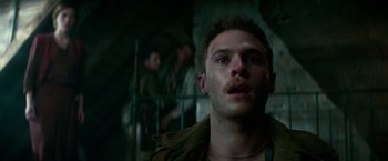 Movie still from “Overlord” (2018), directed by Julius Avery – A person with a beard looking up; Close Up shot, Low angle