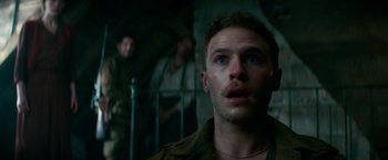 Movie still from “Overlord” (2018), directed by Julius Avery – A person looking up at the sky; Close Up shot, Low angle