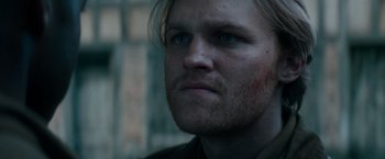 Movie still from “Overlord” (2018), directed by Julius Avery – A person with a beard; Close Up shot, Low angle