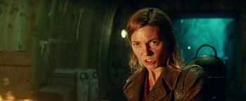 Movie still from “Overlord” (2018), directed by Julius Avery – A person wearing a brown jacket; Close Up shot, Low angle