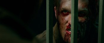Movie still from “Overlord” (2018), directed by Julius Avery – A person with blood on their face; Close Up shot, Overhead angle