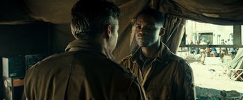 Movie still from “Overlord” (2018), directed by Julius Avery – A man looking at himself in the mirror; Close Up shot, Over the shoulder angle