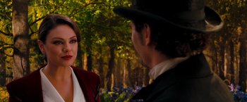 Movie still from “Oz the Great and Powerful” (2013), directed by Sam Raimi – A man and a woman are talking in the woods; Close Up shot, Over the shoulder angle