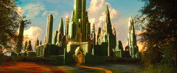 Movie still from “Oz the Great and Powerful” (2013), directed by Sam Raimi – An artistic rendering of a castle with a sky in the background; Extreme Wide shot, High angle