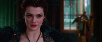 Movie still from “Oz the Great and Powerful” (2013), directed by Sam Raimi – A person wearing a costume; Close Up shot, Over the shoulder angle