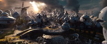 Movie still from “Oz the Great and Powerful” (2013), directed by Sam Raimi – A group of tea kettles sitting on top of a pile of rocks; Extreme Wide shot, High angle