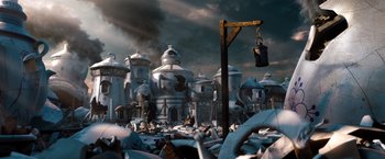 Movie still from “Oz the Great and Powerful” (2013), directed by Sam Raimi – An image of an animated movie scene with a lot of garbage; Extreme Wide shot, High angle