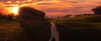 Movie still from “Oz the Great and Powerful” (2013), directed by Sam Raimi – A person standing on a path in a field; Extreme Wide shot, High angle