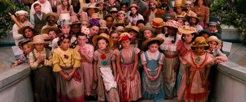 Movie still from “Oz the Great and Powerful” (2013), directed by Sam Raimi – A large group of children dressed up in costumes; Medium shot, High angle