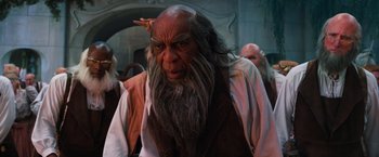 Movie still from “Oz the Great and Powerful” (2013), directed by Sam Raimi – An old man with long hair and a long beard; Close Up shot, Low angle
