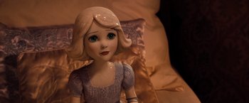 Movie still from “Oz the Great and Powerful” (2013), directed by Sam Raimi – A doll's face in a room; Close Up shot, High angle