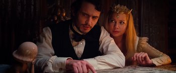 Movie still from “Oz the Great and Powerful” (2013), directed by Sam Raimi – A man and a woman sitting next to each other; Close Up shot, Over the shoulder angle