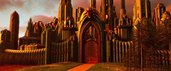 Movie still from “Oz the Great and Powerful” (2013), directed by Sam Raimi – An artistic rendering of a castle with a door open; Extreme Wide shot, Low angle