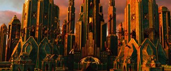 Movie still from “Oz the Great and Powerful” (2013), directed by Sam Raimi – An artistic rendering of a futuristic city with a sky background; Extreme Wide shot, Low angle