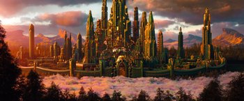 Movie still from “Oz the Great and Powerful” (2013), directed by Sam Raimi – An artistic rendering of a castle with a sky filled with clouds; Extreme Wide shot, High angle