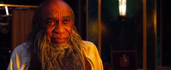 Movie still from “Oz the Great and Powerful” (2013), directed by Sam Raimi – An old man with long hair and a long beard; Close Up shot, Over the shoulder angle