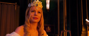 Movie still from “Oz the Great and Powerful” (2013), directed by Sam Raimi – A woman with long blonde hair wearing a crown; Close Up shot, Low angle