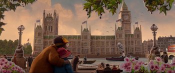 Movie still from “Paddington 2” (2017), directed by Paul King – A painting of a city with a boat in the water; Extreme Wide shot, Low angle