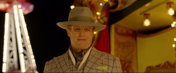 Movie still from “Paddington 2” (2017), directed by Paul King – An older man wearing a hat and glasses; Close Up shot, Low angle