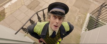 Movie still from “Paddington 2” (2017), directed by Paul King – A man wearing a uniform and a hat; Close Up shot, Low angle