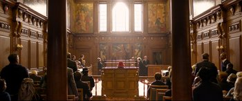 Movie still from “Paddington 2” (2017), directed by Paul King – A court room filled with people in suits and gowns; Extreme Wide shot, High angle
