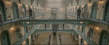Movie still from “Paddington 2” (2017), directed by Paul King – A group of people standing inside of a building; Extreme Wide shot, High angle