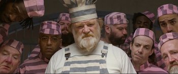 Movie still from “Paddington 2” (2017), directed by Paul King – A group of men wearing chef's hats and aprons; Close Up shot, Low angle