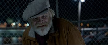 Movie still from “Paddington 2” (2017), directed by Paul King – An old man with a beard wearing a hat and jacket; Close Up shot, Low angle