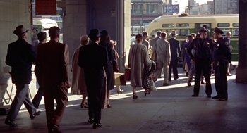 Movie still from “Pal Joey” (1957), directed by George Sidney – A crowd of people walking down a sidewalk; Wide shot, High angle