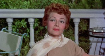 Movie still from “Pal Joey” (1957), directed by George Sidney – A person wearing a scarf; Close Up shot, Low angle