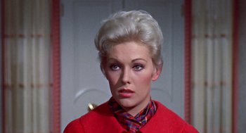 Movie still from “Pal Joey” (1957), directed by George Sidney – A person wearing a suit and tie; Close Up shot, High angle