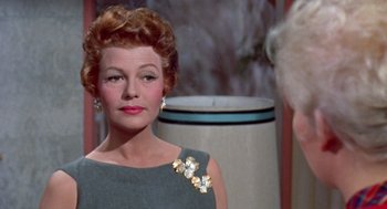 Movie still from “Pal Joey” (1957), directed by George Sidney – A person wearing a dress; Close Up shot, Over the shoulder angle