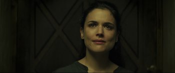 Movie still from “Palm Trees in the Snow” (2015), directed by Fernando González Molina – A person looking at the camera; Close Up shot, Low angle