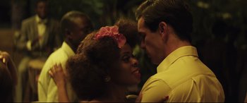 Movie still from “Palm Trees in the Snow” (2015), directed by Fernando González Molina – A man and a woman are dancing together; Close Up shot, Over the shoulder angle