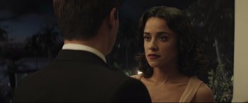 Movie still from “Palm Trees in the Snow” (2015), directed by Fernando González Molina – A man and a woman looking at one another in the mirror; Close Up shot, Over the shoulder angle