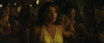 Movie still from “Palm Trees in the Snow” (2015), directed by Fernando González Molina – A woman in a yellow dress standing next to a man; Close Up shot, Over the shoulder angle