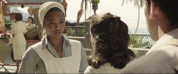 Movie still from “Palm Trees in the Snow” (2015), directed by Fernando González Molina – Two women are talking in front of each other outside; Close Up shot, Over the shoulder angle