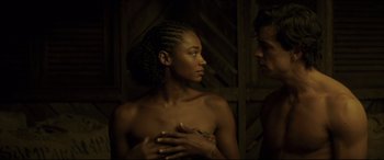 Movie still from “Palm Trees in the Snow” (2015), directed by Fernando González Molina – A man and a woman standing next to each other; Medium shot, Over the shoulder angle