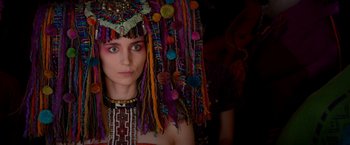 Movie still from “Pan” (2015), directed by Joe Wright – A woman wearing a headdress and a necklace; Close Up shot, Over the shoulder angle