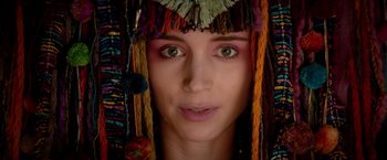 Movie still from “Pan” (2015), directed by Joe Wright – A person wearing a headdress; Close Up shot, Overhead angle