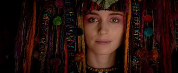 Movie still from “Pan” (2015), directed by Joe Wright – A person wearing a headdress; Close Up shot, Overhead angle