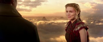 Movie still from “Pan” (2015), directed by Joe Wright – A woman standing in front of a sky filled with clouds; Close Up shot, Over the shoulder angle