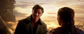 Movie still from “Pan” (2015), directed by Joe Wright – A man and a woman standing next to each other in front of a sunset; Close Up shot, Over the shoulder angle