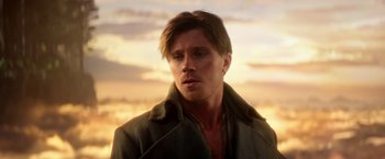 Movie still from “Pan” (2015), directed by Joe Wright – A person wearing a jacket; Close Up shot, Over the shoulder angle