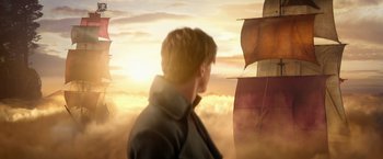 Movie still from “Pan” (2015), directed by Joe Wright – A man standing in front of a ship in the sky; Extreme Wide shot, Low angle
