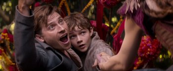 Movie still from “Pan” (2015), directed by Joe Wright – A man and a boy are looking at each other; Close Up shot, Over the shoulder angle